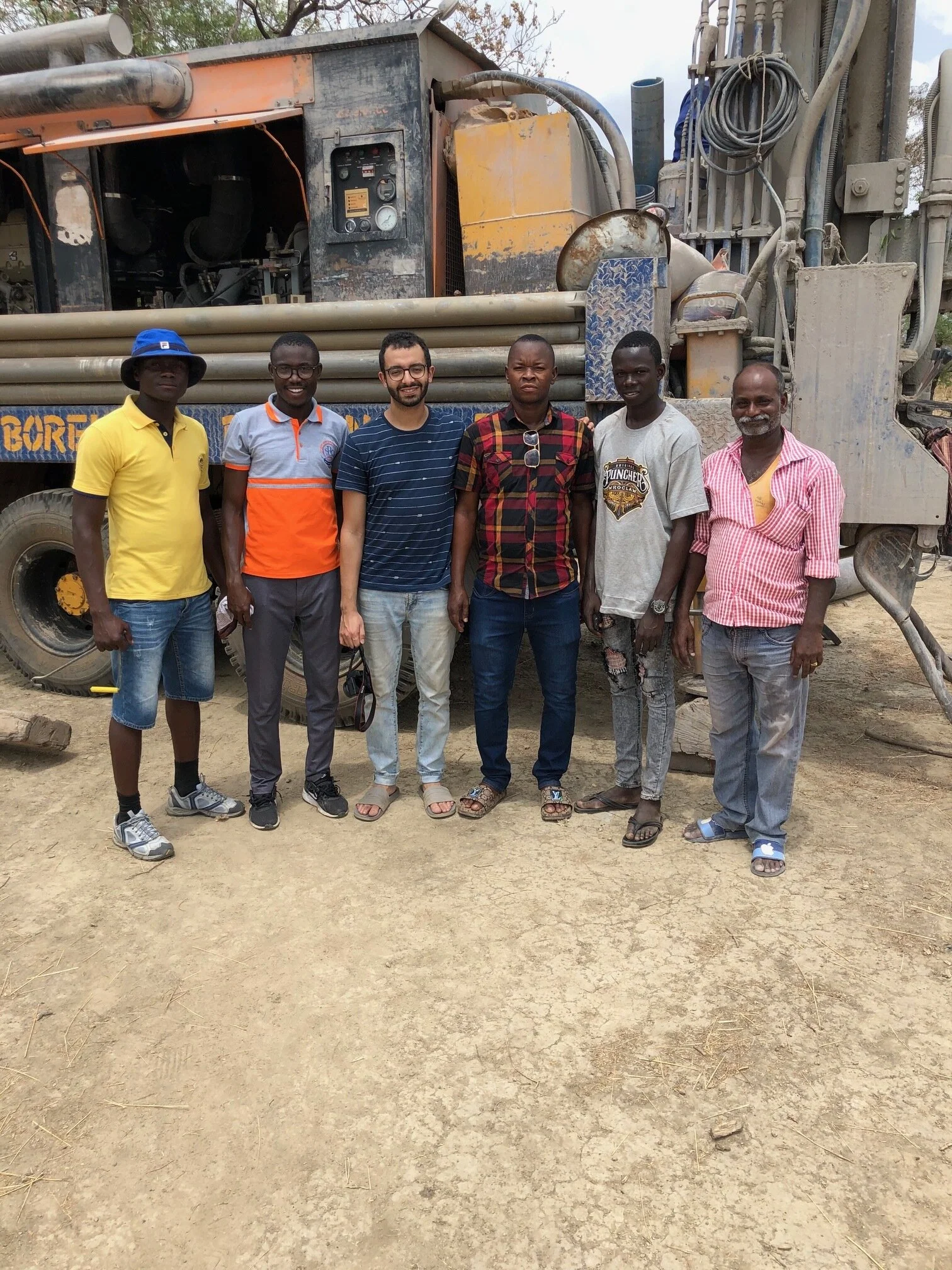 A rural community gather point near a completed water well in Larabanga, Ghana